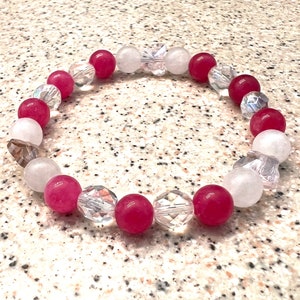 The BUTTERFLY handmade natural gemstone stretch bracelet is made with pink and white chalcedony, clear Czech glass & pink Czech butterfly