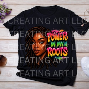 May include: Black t-shirt featuring a vibrant illustration of a woman with long braids. The graphic includes the text "POWER IN MY ROOTS" in colorful lettering, set against a watercolor-style background. The shirt is a casual wear item.