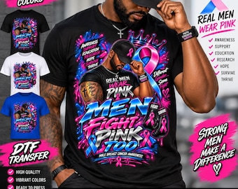May include: A black t-shirt featuring a graphic of a person wearing a cap and boxing gloves, with the text "REAL MEN WEAR PINK" and "MEN FIGHT PINK TOO". The design includes pink and blue ribbons, a crown, and the words "AWARENESS, SUPPORT, EDUCATION, RESEARCH, HOPE, SURVIVE, THRIVE".