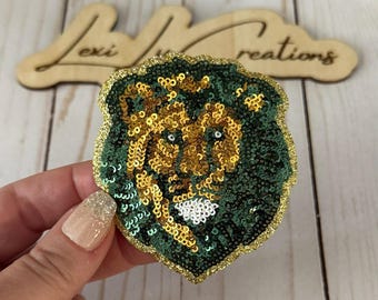 Parche de sombrero de león con lentejuelas verdes y doradas de SLU / Mascota de ropa deportiva / Sureste