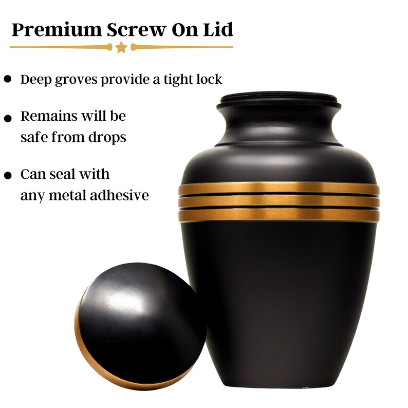 May include: Black urn with gold trim and a matching screw-on lid. The urn has a smooth, polished finish.  "Premium Screw On Lid" is written at the top of the image.  "Deep grooves provide a tight lock" is written below the title.  "Remains will be safe from drops" is written below that.  "Can seal with any metal adhesive" is written below that.