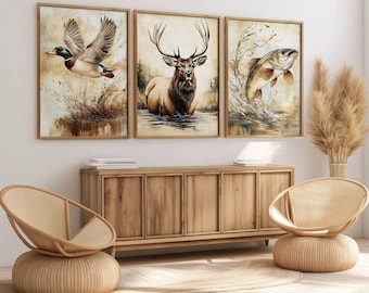 Könnte beinhalten: Drei gerahmte Kunstdrucke mit Wildtierszenen. Die Drucke zeigen eine fliegende Ente, einen Hirsch im Wasser und einen Fisch, der aus dem Wasser springt. Die Rahmen sind hellbraun und die Kunstwerke sind im Aquarellstil gehalten.