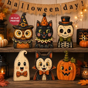 Könnte beinhalten: Ein Set aus sechs flachen 2D-Halloween-Dekorationen, bestehend aus einer Eule mit Hexenhut, einer schwarzen Katze, einem Skelett, einem Geist mit Fliege, einem Vampir und einem Kürbis, die alle auf einem Holzregal angeordnet sind.