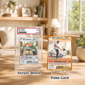 May include: Two collectible cards for Father's Day. One card is encased in a clear acrylic block, labeled "NO. 1 DAD." The other card is displayed on a clear stand. Both cards feature illustrations and text, including "Happy Father's Day 2026."