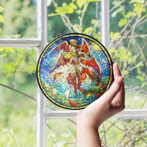 May include: A round stained glass art piece with a black metal frame. The artwork features a colorful illustration of a figure with wings, wearing a hat, and holding a violin. The background is a mix of blue, red, yellow, and green.
