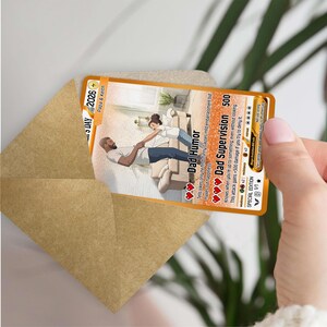 May include: A gold-bordered card with the text "Dad Humor" and "Dad Supervision" is held in a brown envelope. The card features an illustration of a father and child. The card reads "SPECIAL EDITION" and "2026".