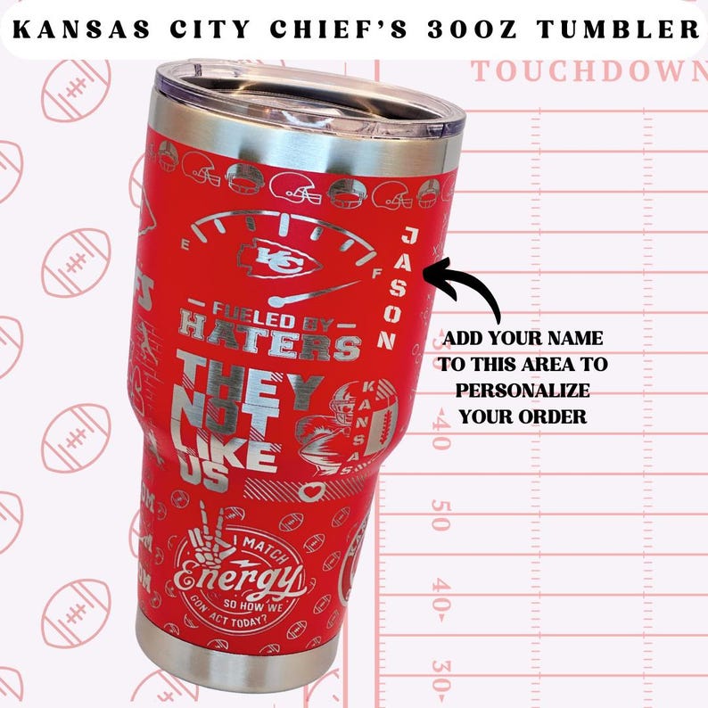 May include: A red and silver 30 oz stainless steel tumbler with a Kansas City Chiefs logo and the text "Fueled by Haters - They Not Like Us". The tumbler has a personalised name area.