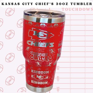 May include: Red stainless steel tumbler featuring a Kansas City Chiefs logo and various team-related graphics. The tumbler is 30 ounces and has a silver lid.