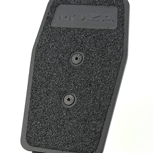 May include: Close-up of a black textured pedal with the embossed word "MOZA". Two screws secure the textured pad to the pedal base. The pedal is designed for use in sim racing.