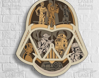 May include: A layered wooden cutout of Darth Vader's helmet with various Star Wars characters inside, including Yoda, R2-D2, Princess Leia, Chewbacca, Han Solo, and Boba Fett.