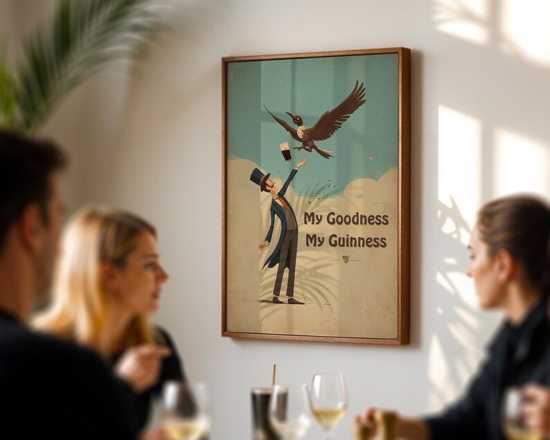 May include: A framed art print with a humorous illustration. A man in a top hat and suit attempts to catch a pint of Guinness from a bird. The text "My Goodness My Guinness" is displayed below the image.