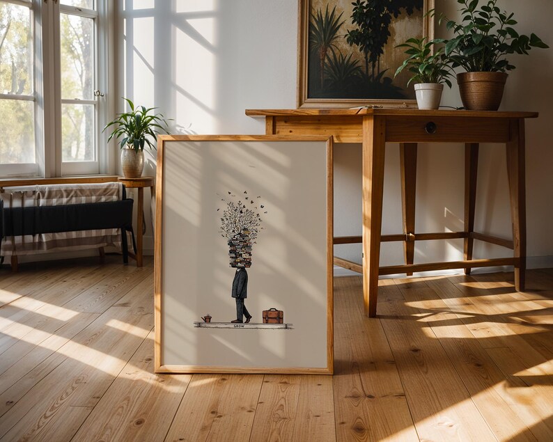 Puede incluir: Impresi&oacute;n art&iacute;stica enmarcada que presenta una ilustraci&oacute;n estilizada de una persona con una pila de libros en la cabeza, un malet&iacute;n y una taza peque&ntilde;a. La obra de arte est&aacute; en un marco de madera y sobre un fondo neutro. El tema general es intelectual y art&iacute;stico.