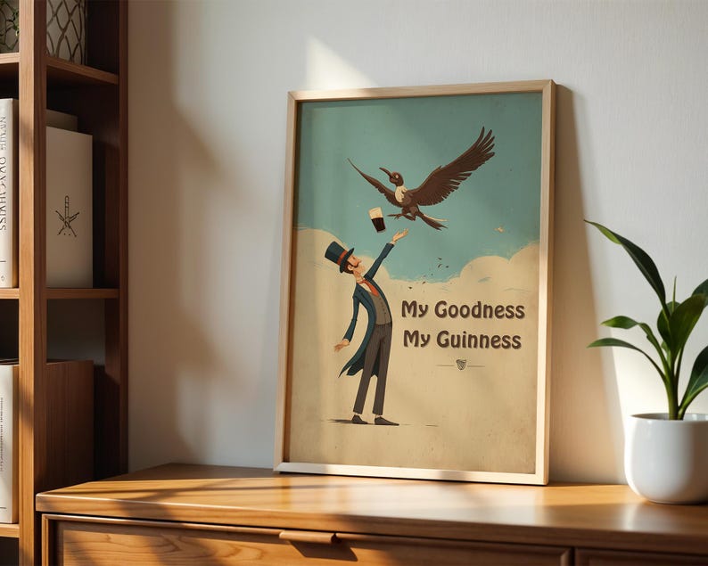 May include: A framed print with a vintage aesthetic, depicting a man in a top hat and tails reaching for a pint of Guinness, with a bird flying above. The text "My Goodness My Guinness" is displayed in a stylized font against a light blue and cream background.