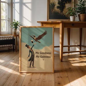 May include: A framed vintage poster featuring a cartoon illustration. It shows a man in a top hat and suit trying to catch a pint of stout from a bird. The poster has the text "My Goodness My Guinness" at the bottom.