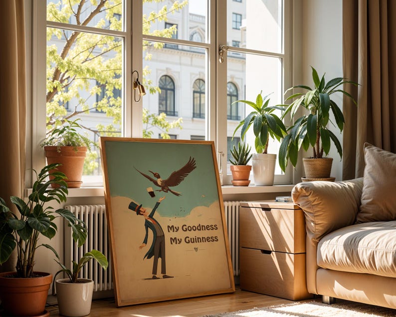 May include: A framed vintage poster with the text "My Goodness My Guinness" shows a cartoon illustration of a man in a top hat and a bird. The poster is displayed in a room with plants and a window.