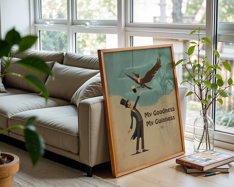 May include: A framed vintage poster with the text "My Goodness My Guinness." The artwork shows a man in a top hat reaching for a pint of stout, with a bird flying above. The frame is made of wood.