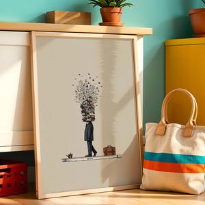 Puede incluir: Impresi&oacute;n art&iacute;stica enmarcada con una ilustraci&oacute;n surrealista de una persona con una pila de libros en lugar de cabeza, caminando sobre una l&iacute;nea. La obra de arte incluye una peque&ntilde;a regadera, un malet&iacute;n y la palabra "GROW". Una bolsa de lona con rayas azules y naranjas est&aacute; en primer plano.