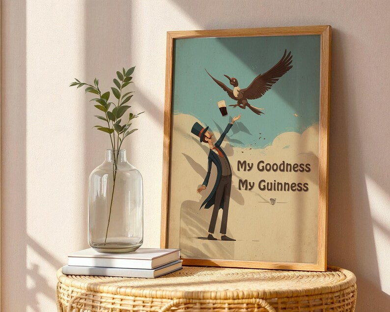 May include: A framed vintage print with a man in a top hat and coat reaching for a pint of Guinness, with a bird flying above. The text "My Goodness My Guinness" is displayed below the image. The print is in a wooden frame.