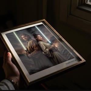May include: A framed digital art print featuring two individuals standing back-to-back, each holding a glowing lightsaber. One lightsaber is green and the other is white. The individuals wear brown and beige robes. The text VELIZMAN DIGITAL ART is visible.