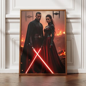 May include: A framed wall art print depicting two figures in dark attire standing against a fiery, volcanic landscape. Both figures hold glowing red lightsabers crossed in front of them. Two TIE fighter silhouettes are visible in the smoky sky.