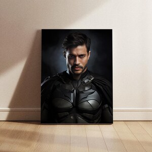 May include: A man dressed as a superhero, wearing a black and silver costume with a cape. He has short dark hair and a serious expression on his face.