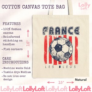 May include: Natural cotton canvas tote bag with a graphic of a soccer ball and the word "FRANCE". The bag is 15 inches wide and 16 inches tall. Features include reinforced stitching on the handles and flat corners.