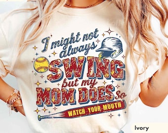 May include: An ivory short-sleeve t-shirt featuring a graphic with a baseball helmet, a yellow softball, and a baseball bat. The text reads: I might not always SWING but my MOM DOES so WATCH YOUR MOUTH. The Comfort Colors logo is visible.