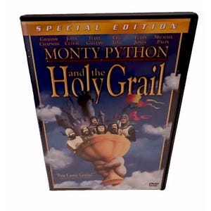 May include: DVD cover for the movie Monty Python and the Holy Grail. The cover features a black background with a blue and white sky. The title of the movie is in white letters with a red border. The cast members are listed in white letters below the title. The cover also features a picture of the cast members holding the Holy Grail.