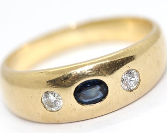 Vintage 14k gold band ring set with two diamonds and sapphire