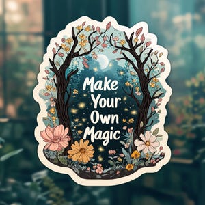 May include: A sticker with a whimsical forest scene featuring two trees with blooming flowers, a moon, and sparkling lights. The text "Make Your Own Magic" is written in a stylized font.