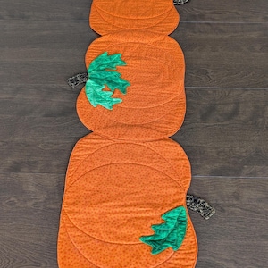Pumpkin table runner ~ Fall pumpkin table runner ~ 13&quot; x 45&quot; ~ quilted with dimensional leaves ~ hand made.  Fall/autumn decor.