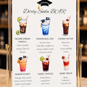 May include: A gold-framed sign displays a menu for a "Dirty Soda BAR." The menu features six colorful soda concoctions, each with a unique name and ingredients like vanilla syrup, cherry syrup, and coconut cream. A graduation cap graphic tops the sign.