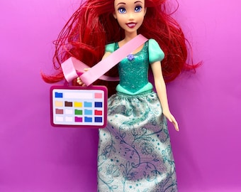 Doll sized acrylic AAC device with ribbon carry strap for display, decoration and to represent diversity of communication and inclusion