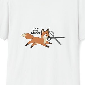 May include: White t-shirt with a cartoon fox running with scissors and the text "I run with scissors".