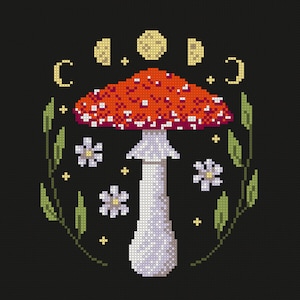 May include: Cross-stitch design of a red and white mushroom with a white stem, surrounded by leaves, flowers, and moon phases, all set against a black background. The design has a whimsical, nature-inspired theme.