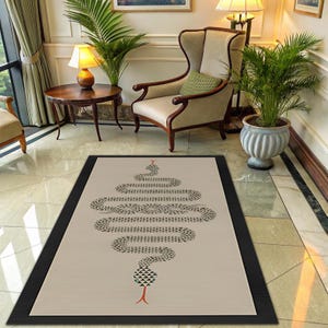 May include: A rectangular area rug featuring a beige centre with a black and white geometric snake pattern winding vertically. The snake has a red forked tongue and small teal accents. The rug is framed by a wide, solid black border.
