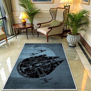 May include: A rectangular rug with a black spaceship design on a light blue backdrop, a large white circle, and smaller spacecraft silhouettes. The rug, edged in white, is laid on a tiled floor, suitable for a living room.