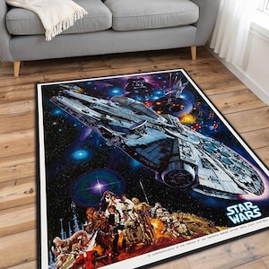 May include: Rectangular Star Wars area rug featuring the Millennium Falcon spaceship in a space scene with Darth Vader and other characters. The rug has a black border and the Star Wars logo in the bottom right corner.