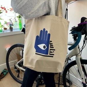 Al Nass Tote Bag - الناس - Neighborhood Watch re-usable shopping bag, Arabic, Ayn Design, Middle Eastern Evil Eye Hamza