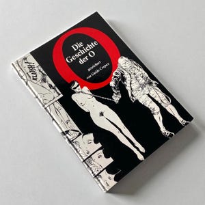 May include: A book titled "Die Geschichte der O" with a black cover and a red circle. The cover features illustrations of a nude person with a blindfold and a man in a period costume. The book's spine shows a comic strip.