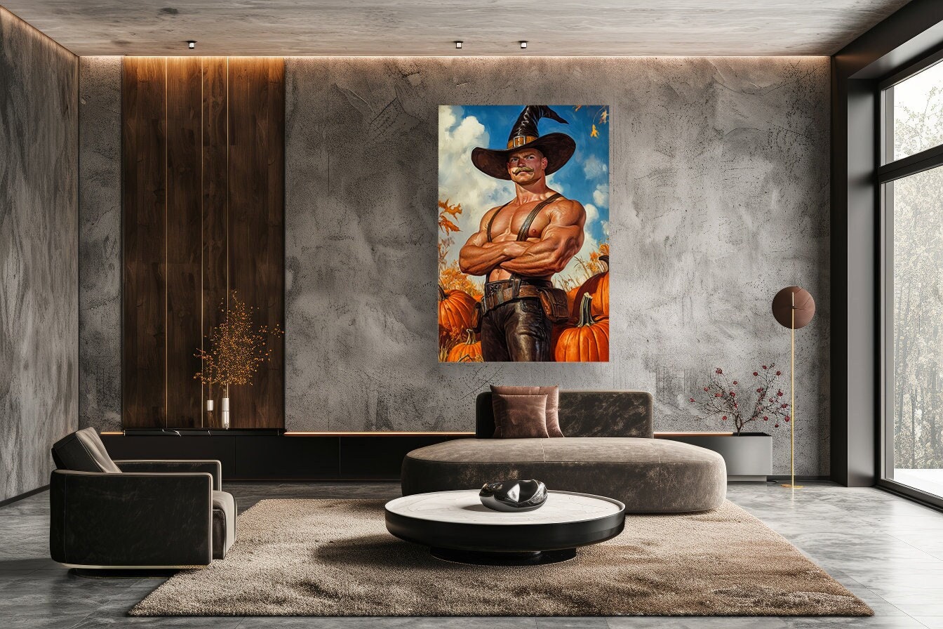 Handsome muscular man witcher in black hat, canvas. Jock, bodybuilde with orange pumpkins, pinting. Gay Man Muscle Sculpting For Halloween
