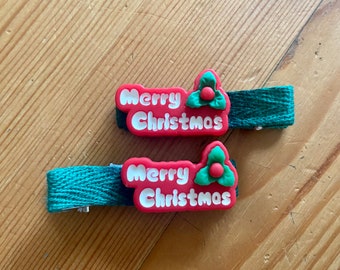 Merry Christmas resin charm on fully lined alligator hair clip. Festive accessory for babies, toddlers, kids and adults. Non-slip and no tug