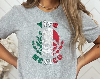 May include: Heather light gray t-shirt with a graphic of the Mexican flag and the text "Viva Mexico".
