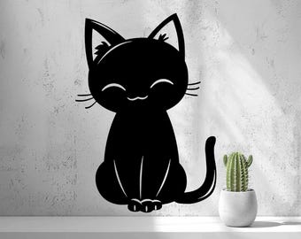 May include: A black cat wall decal featuring a stylized silhouette of a sitting feline with a rounded head, pointed ears, whiskers, and a curved tail. The cat has a simple facial expression with closed eyes and a small mouth.