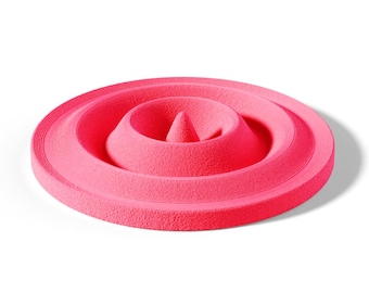 May include: A circular, bright neon pink silicone mold featuring a textured surface with concentric rings and a central cone-shaped protrusion. The object has a flat outer rim and a deep, recessed center designed for creating shaped food items.