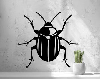 May include: A black graphic illustration of a beetle with elongated antennae and six legs, featuring white vertical stripes on its wing covers. The beetle is positioned above a small green cactus in a white pot.