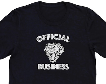 May include: Black t-shirt with a white graphic of a monkey with the text "OFFICIAL BUSINESS" underneath.