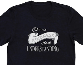 May include: Black t-shirt with a white banner that says "Choose Kindness Seek Understanding".