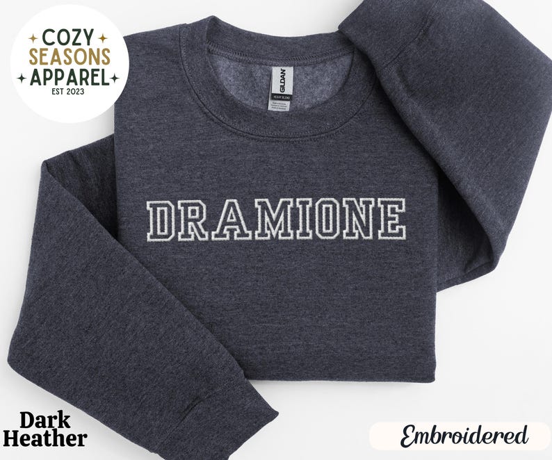 May include: Dark heather grey sweatshirt with the text "DRAMIONE" embroidered in white on the front.