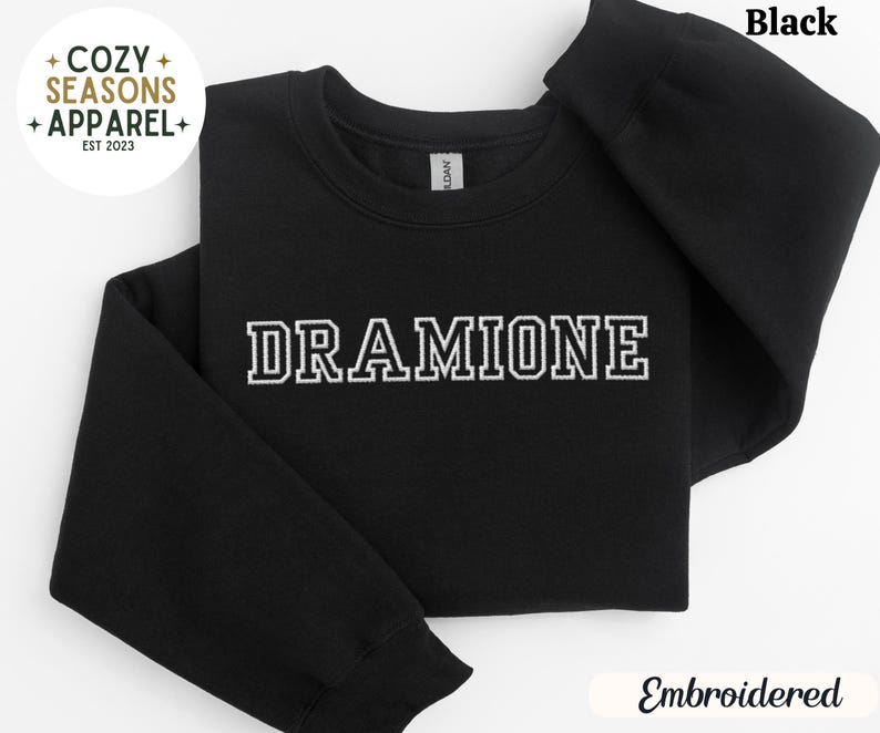 May include: Black sweatshirt with the text "DRAMIONE" embroidered in white.